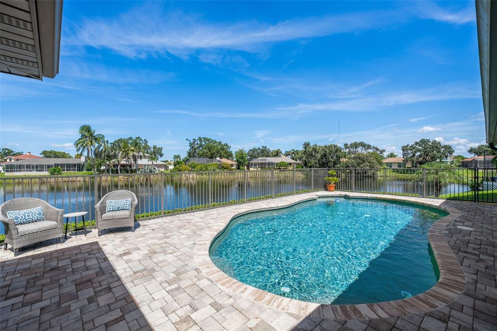 657 Riviera Bay Drive Northeast St. Petersburg, FL 33702 - Photo 2 of 50 a view of a lake with a outdoor space
