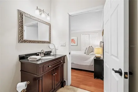 a en suite bathroom with a sink and a mirror