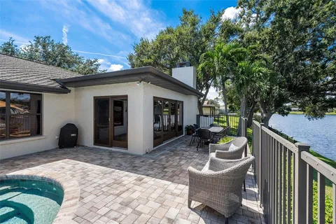 a view of a chair and tables in the balcony