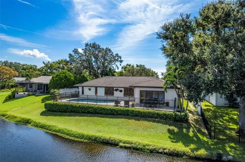 a front view of a house with a yard table and chairs