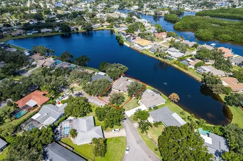 an aerial view of residential house with outdoor space and lake view