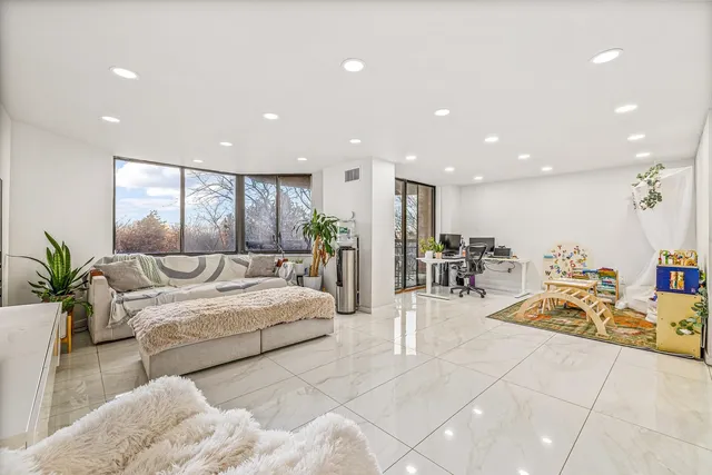 a living room with furniture and a table
