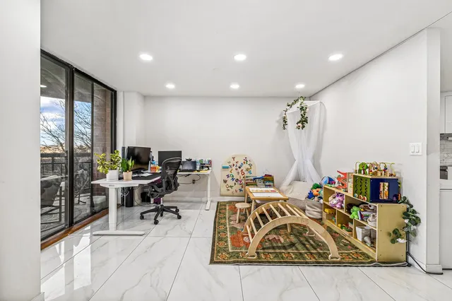 a view of a workspace with furniture