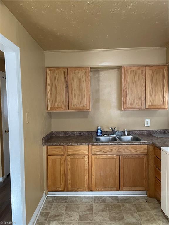 View sink, counter top and cabinets in kitchen