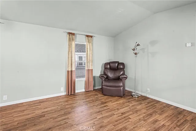 a view of room with wooden floor and chair