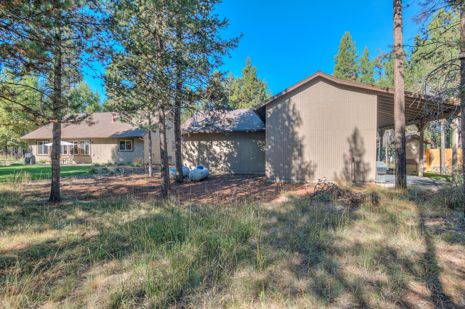 17295 Azusa Road Bend, OR 97707 - Photo 40 of 40 a view of a house with backyard and a tree