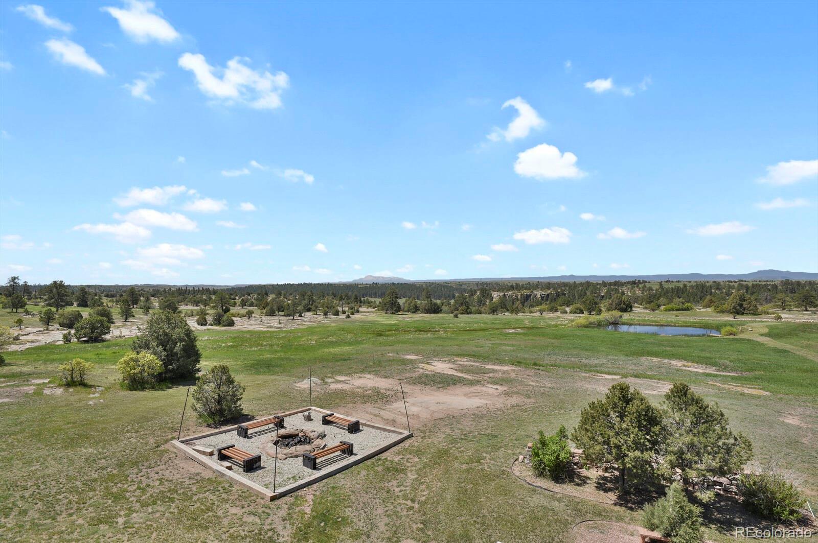 897 East Rim Road Franktown, CO 80116 - Photo 25 of 32 a view of a lake with a city