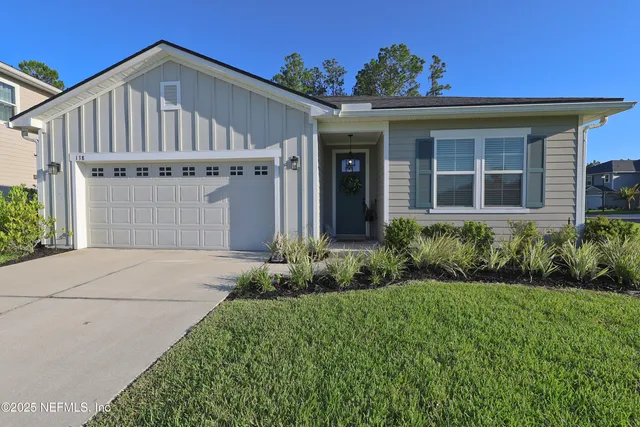 front view of a house with a yard