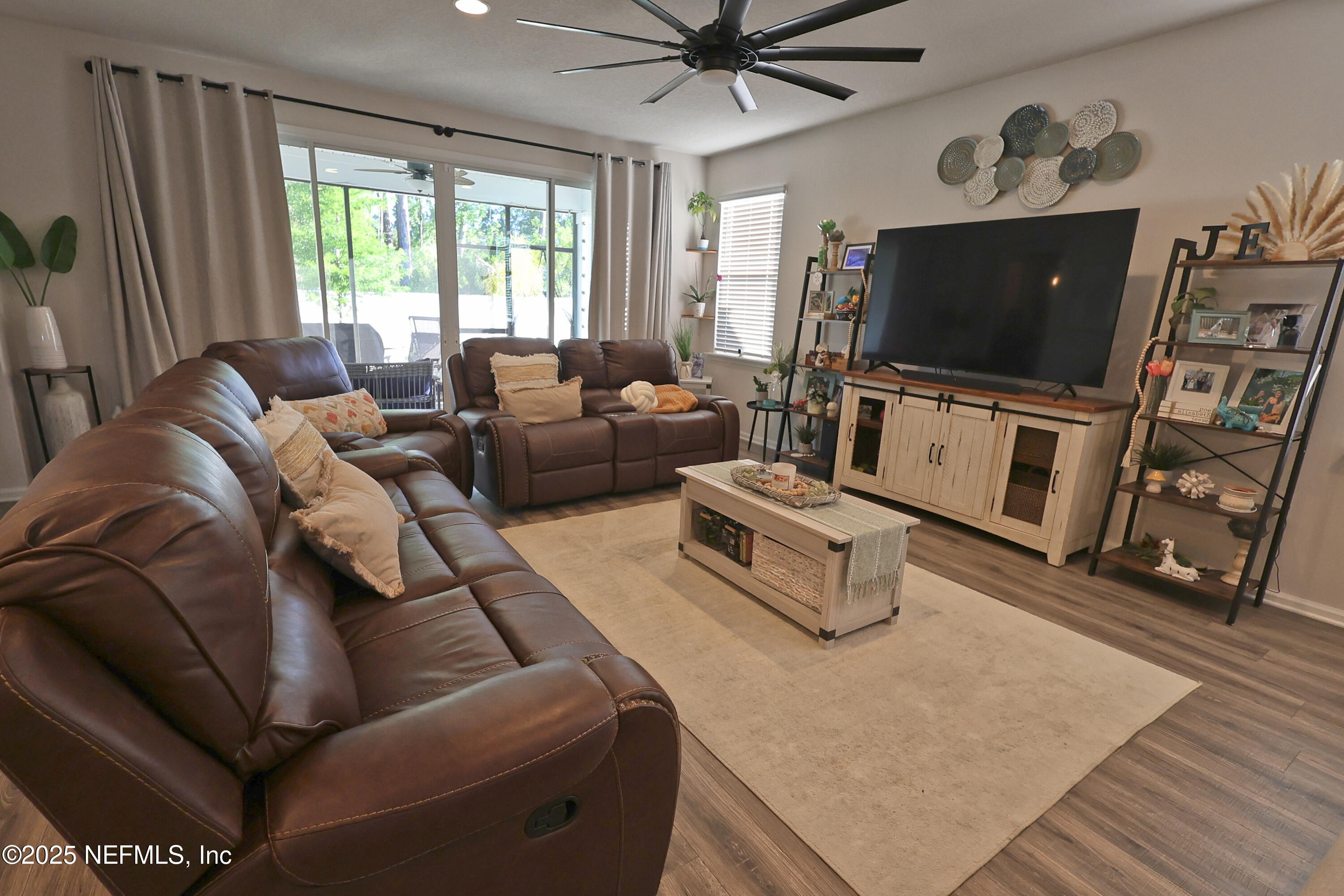 138 Lambert Road St. Johns, FL 32259 - Photo 11 of 50 a living room with furniture and a flat screen tv