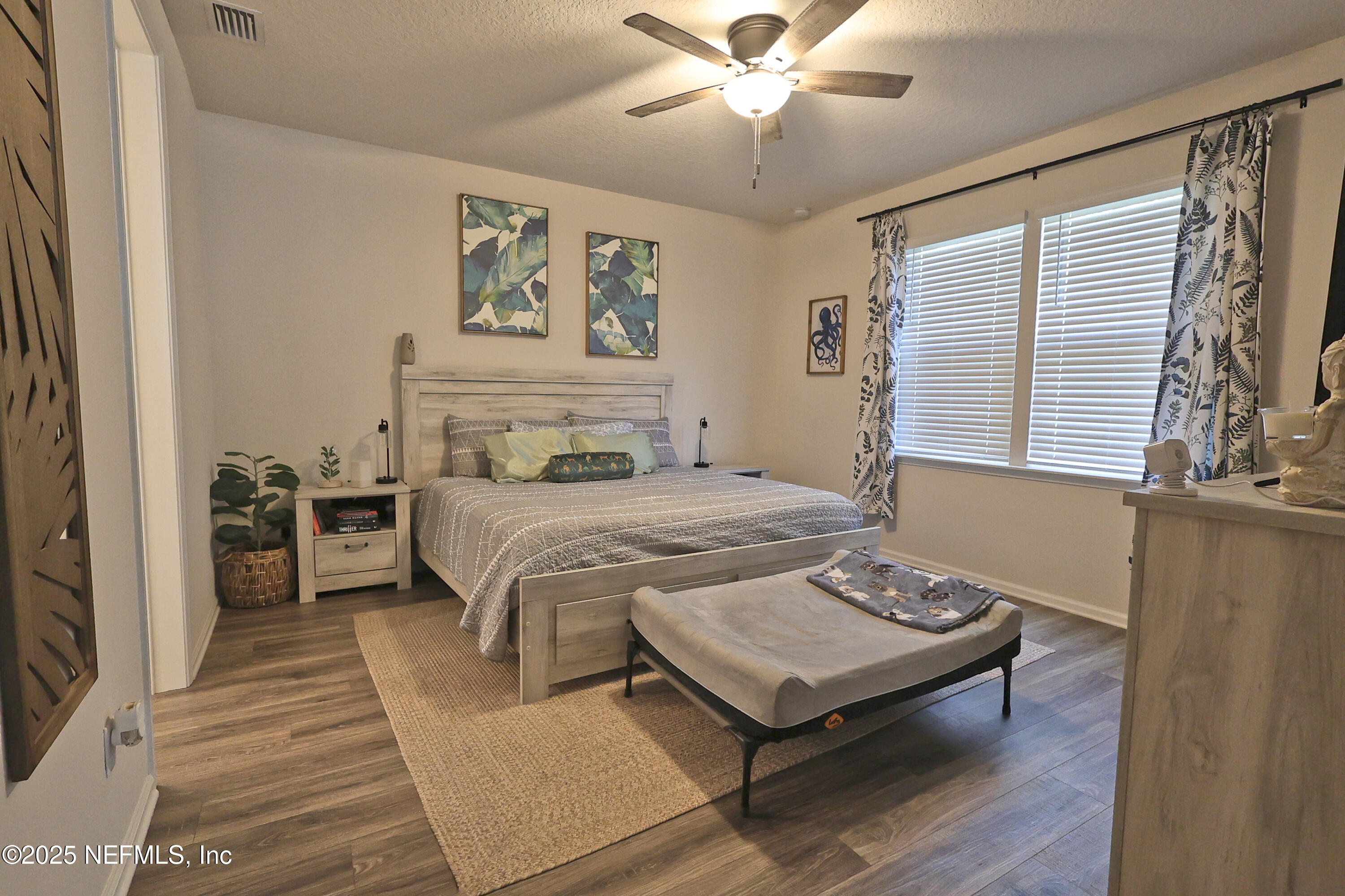 138 Lambert Road St. Johns, FL 32259 - Photo 15 of 50 a bedroom with a bed and a chandelier