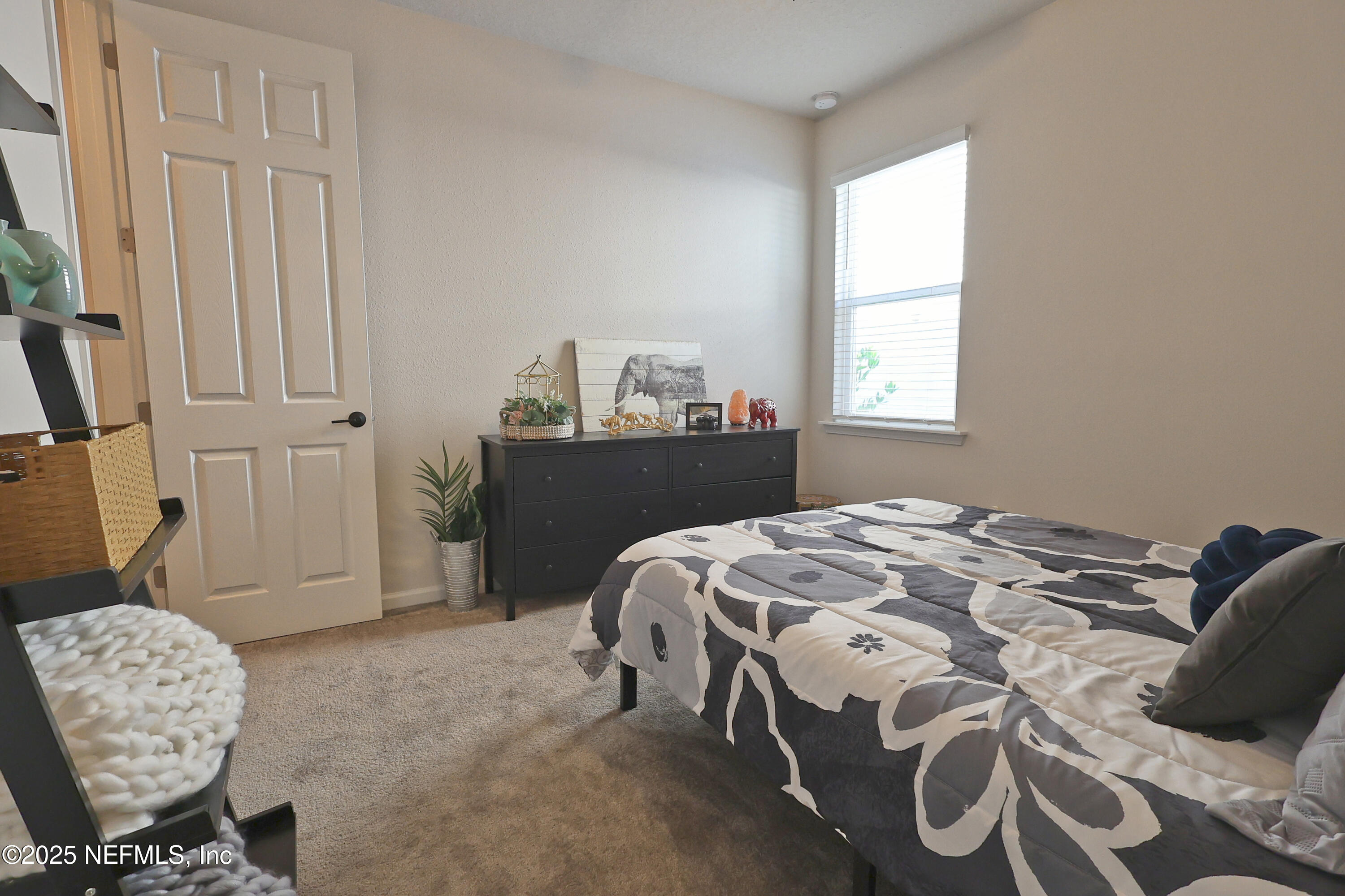 138 Lambert Road St. Johns, FL 32259 - Photo 27 of 50 a bedroom with a bed and a window