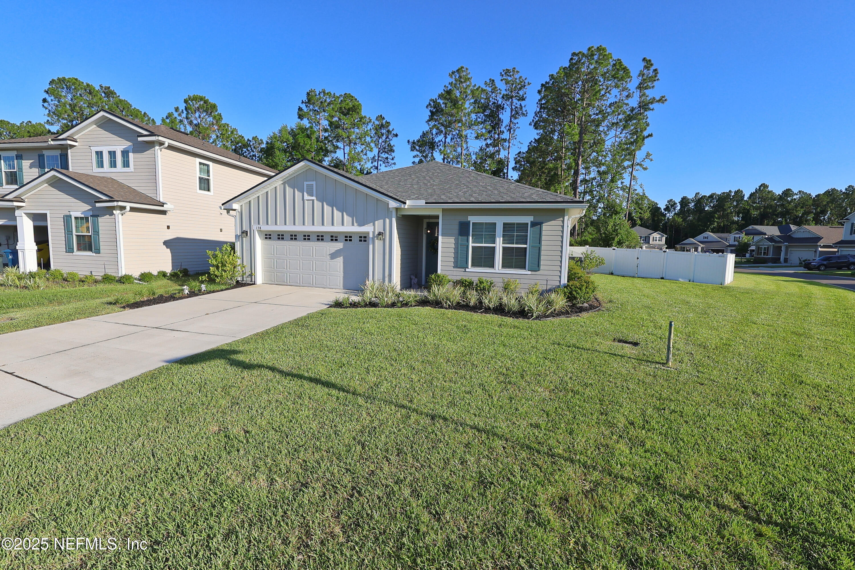 138 Lambert Road St. Johns, FL 32259 - Photo 3 of 50 front view of a house with a yard