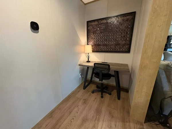a workspace with wooden floor and a workspace