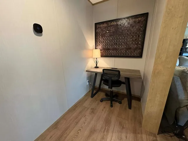 a workspace with wooden floor and a workspace