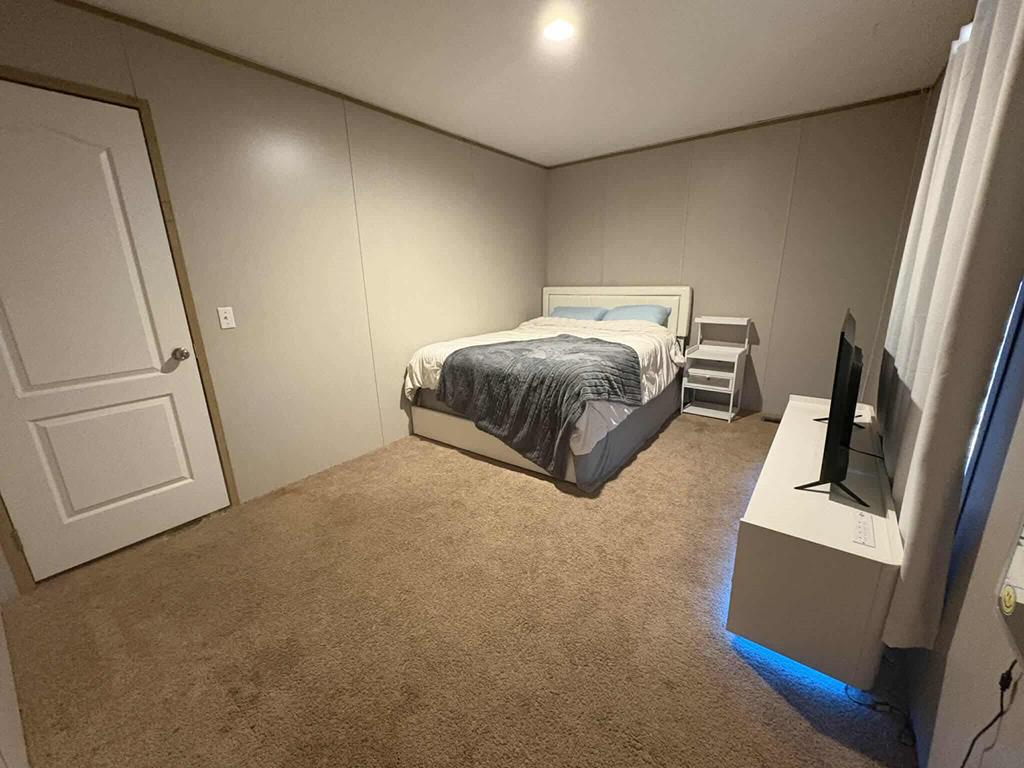 103 Appaloosa Road Buena Vista, GA 31803 - Photo 21 of 24 a bedroom with a bed and a couch