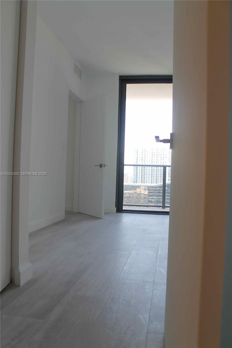 45 Southwest 9th Street, Unit 2109 Miami, FL 33130 - Photo 6 of 40 a view of an empty room with a window