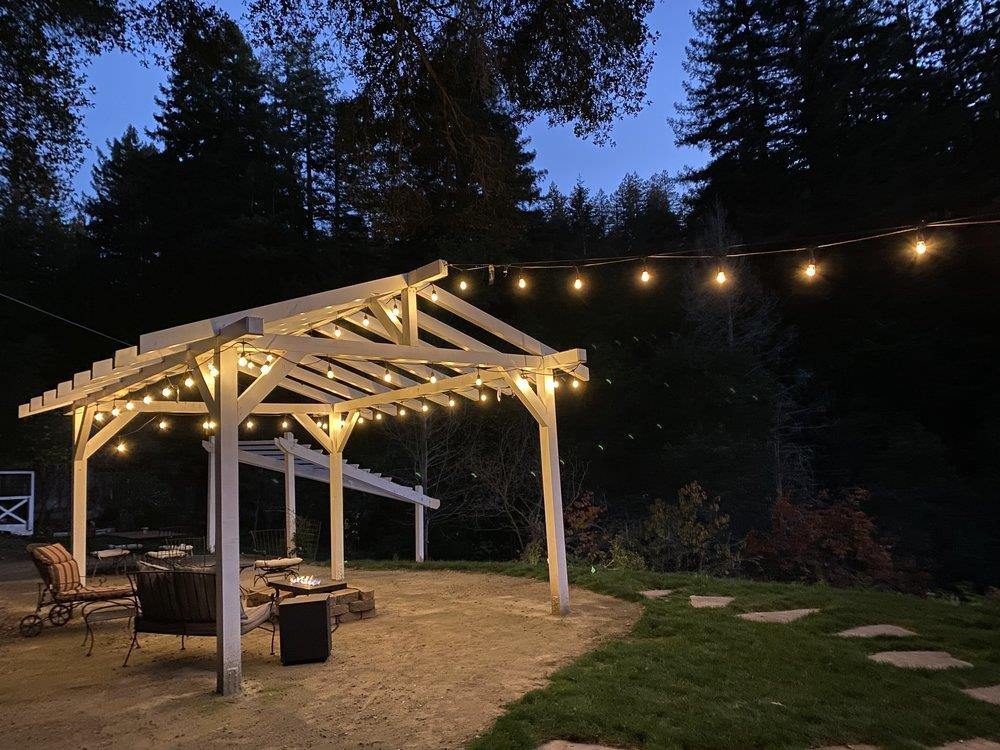 1520 Hall Ranch Road Santa Cruz, CA 95065 - Photo 54 of 54 a view of a patio with chairs and a large tree