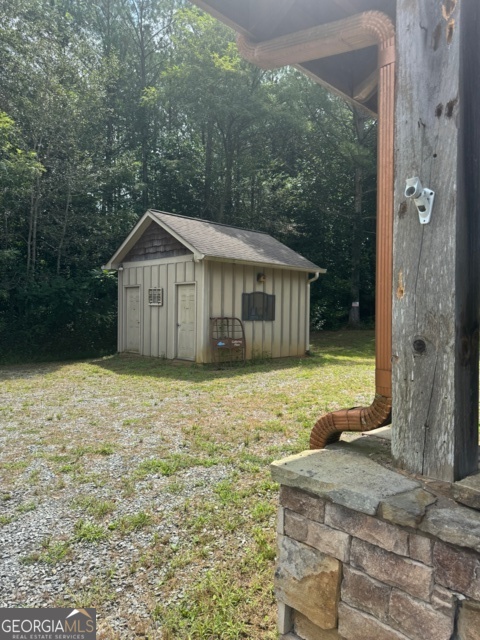 43-44 Reece Mountain Road Ellijay, GA 30536 - Photo 22 of 24 a view of a house with a yard