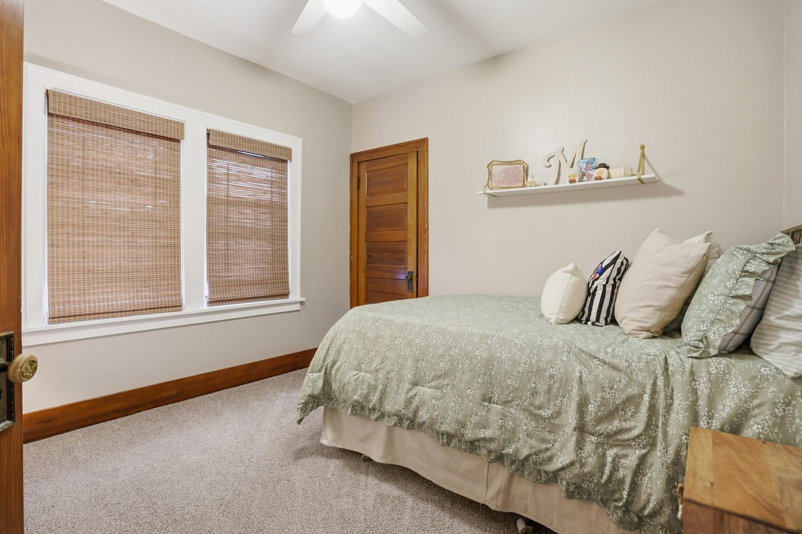 2431 14th Avenue Moline, IL 61265 - Photo 11 of 37 a bed sitting in a bedroom next to a window