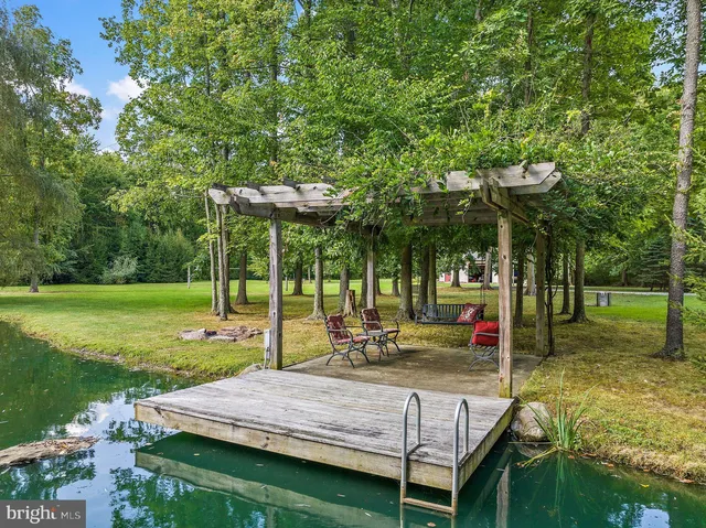 a view of a table and chairs under an umbrella