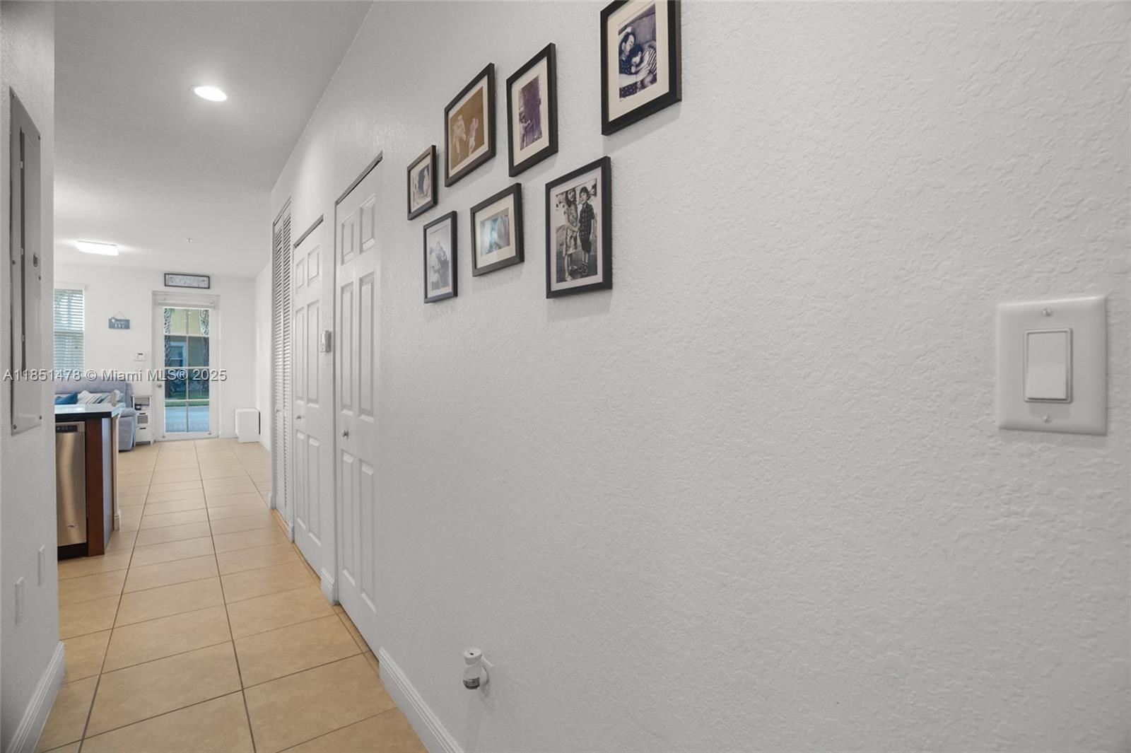14774 Southwest 10th Street, Unit 10502 Pembroke Pines, FL 33027 - Photo 17 of 40 a hallway with cabinets