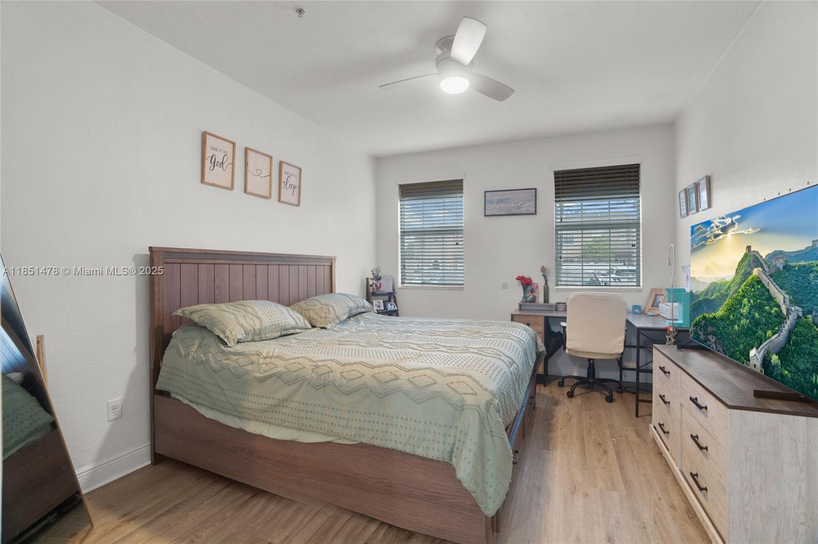 14774 Southwest 10th Street, Unit 10502 Pembroke Pines, FL 33027 - Photo 19 of 40 a bedroom with bed and window