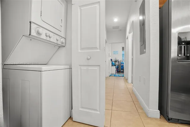 a view of a hallway to rooms and stairs