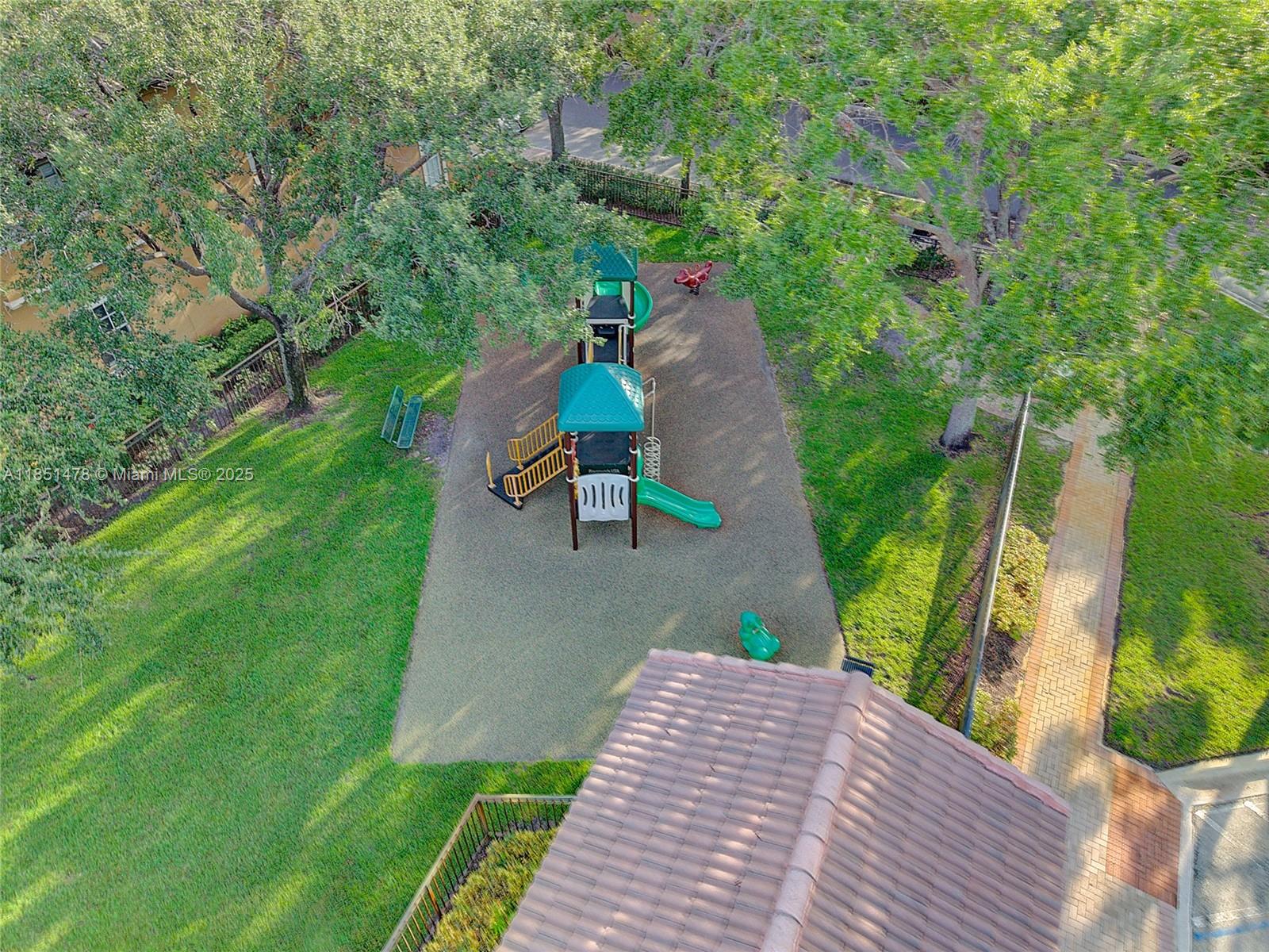 14774 Southwest 10th Street, Unit 10502 Pembroke Pines, FL 33027 - Photo 35 of 40 a view of a backyard with sitting area