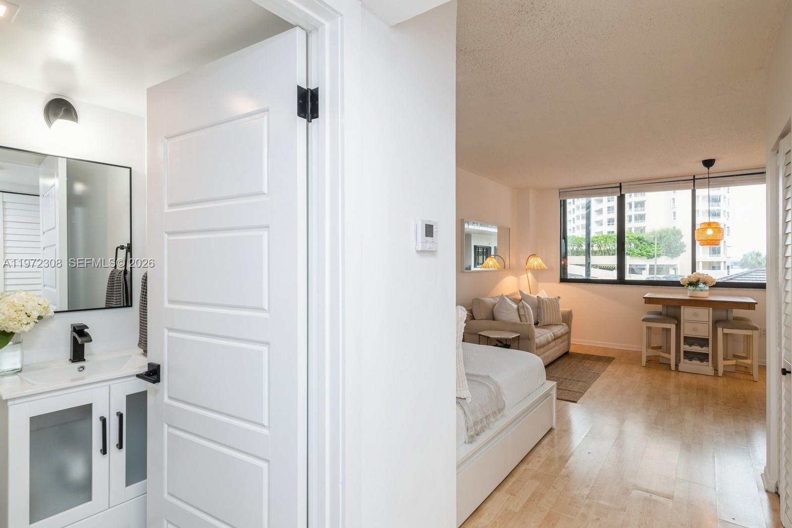 540 Brickell Key Drive, Unit 504 Miami, FL 33131 - Photo 12 of 31 a very nice looking room with a large window