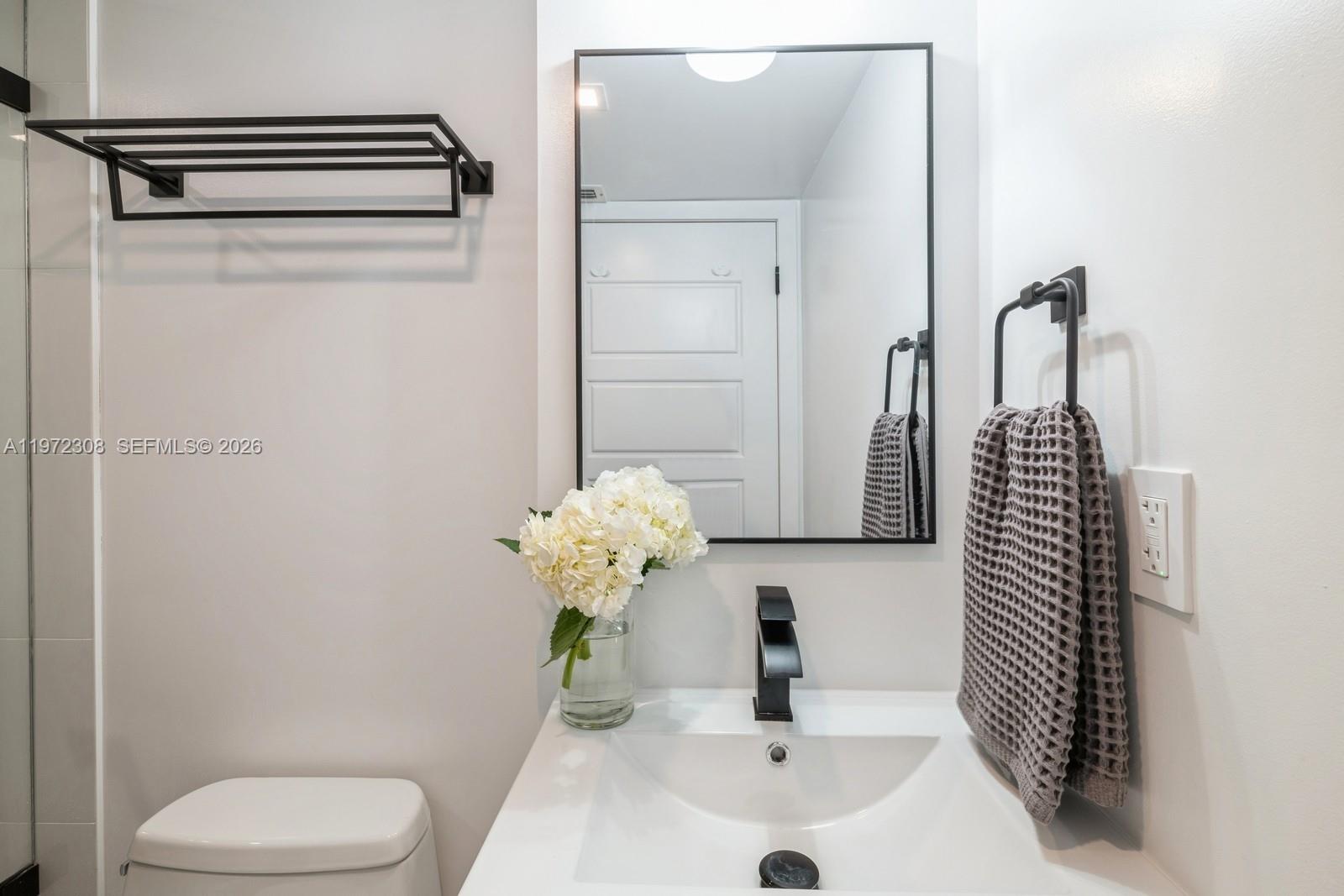 540 Brickell Key Drive, Unit 504 Miami, FL 33131 - Photo 17 of 31 a bathroom with a sink toilet and shower