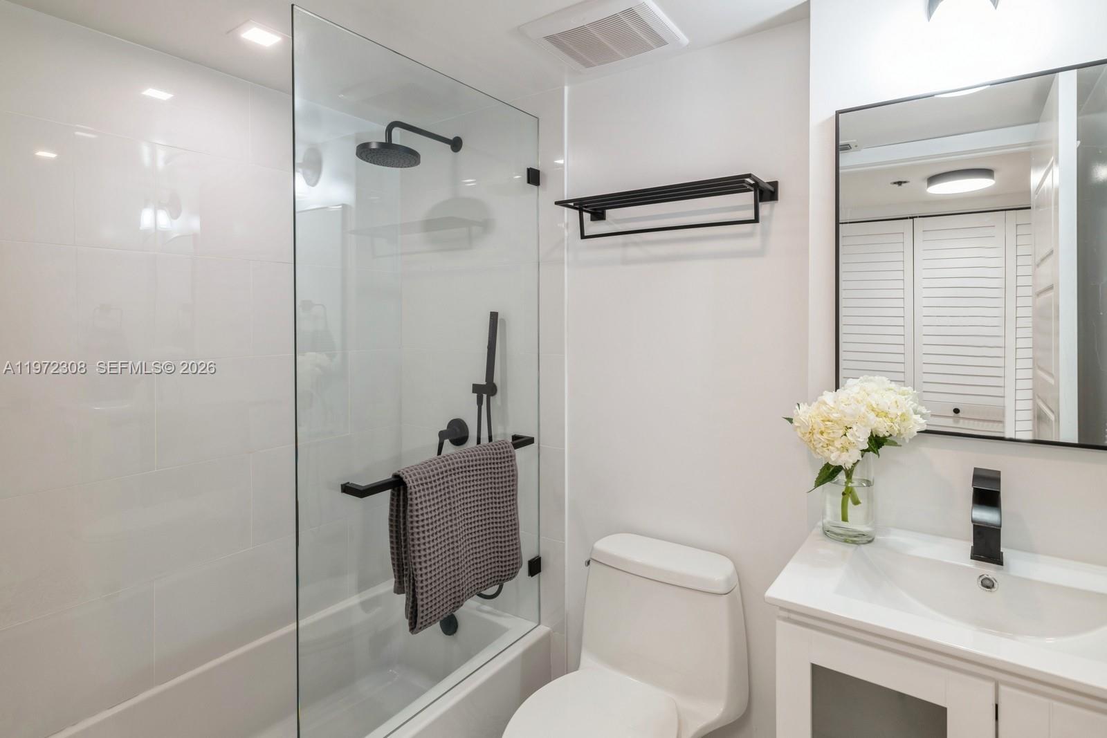 540 Brickell Key Drive, Unit 504 Miami, FL 33131 - Photo 19 of 31 a bathroom with a sink toilet and shower