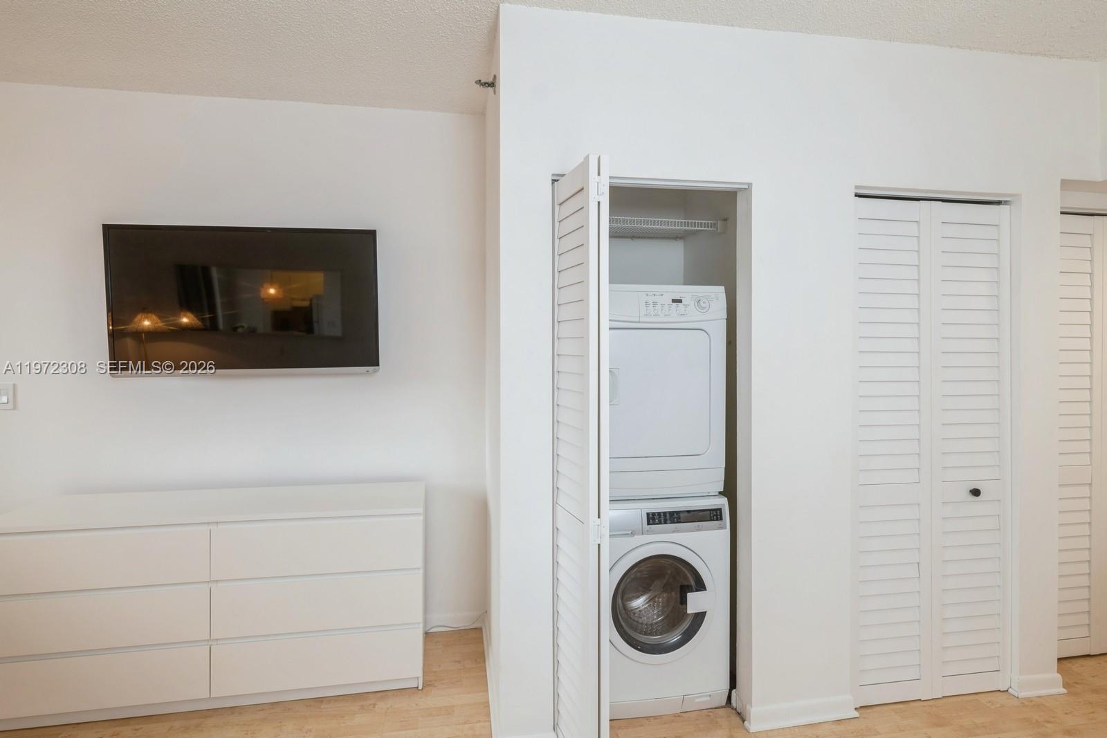 540 Brickell Key Drive, Unit 504 Miami, FL 33131 - Photo 24 of 31 a view of a livingroom with washer and dryer