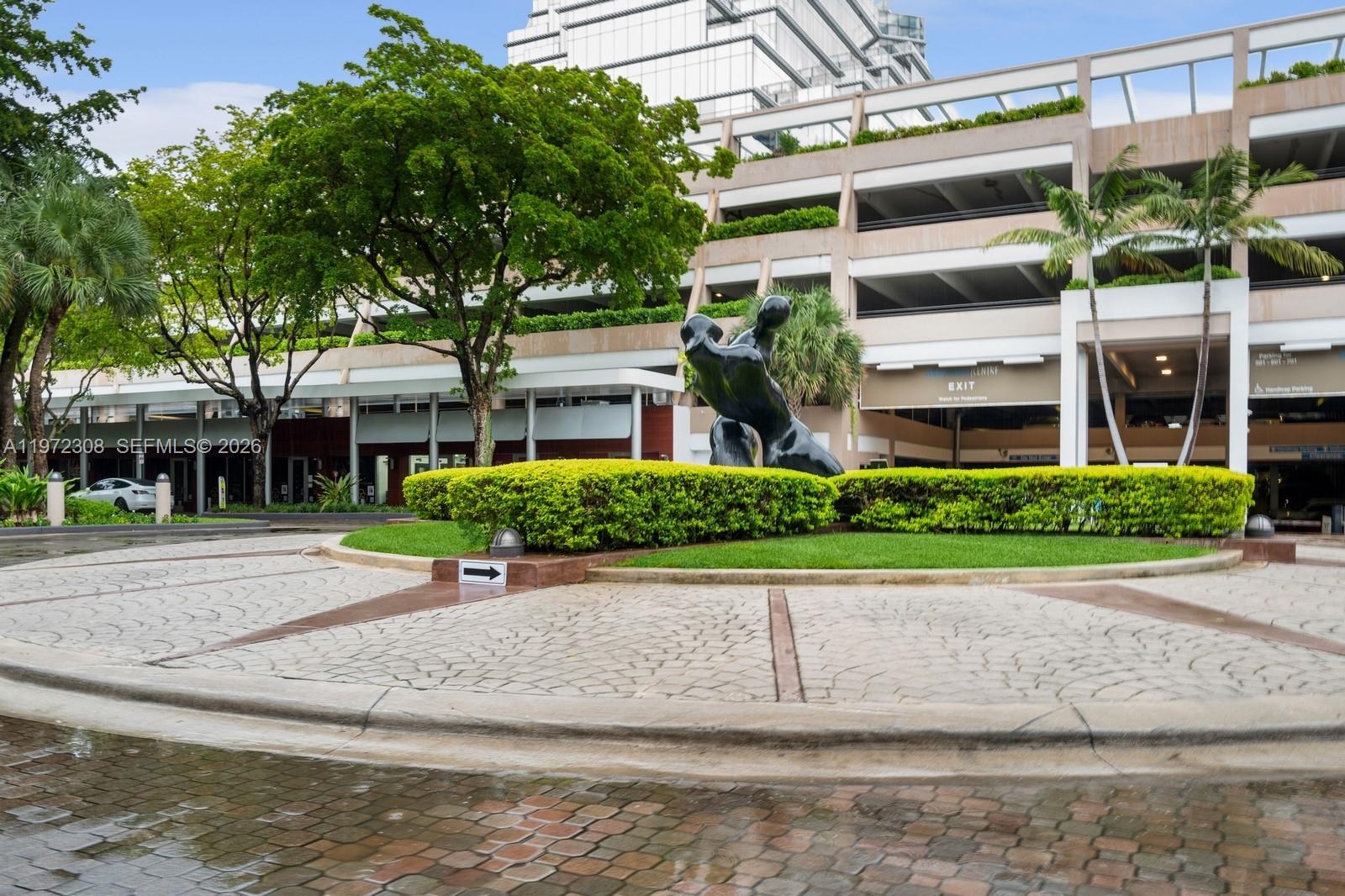 540 Brickell Key Drive, Unit 504 Miami, FL 33131 - Photo 29 of 31 front view of a building with a yard