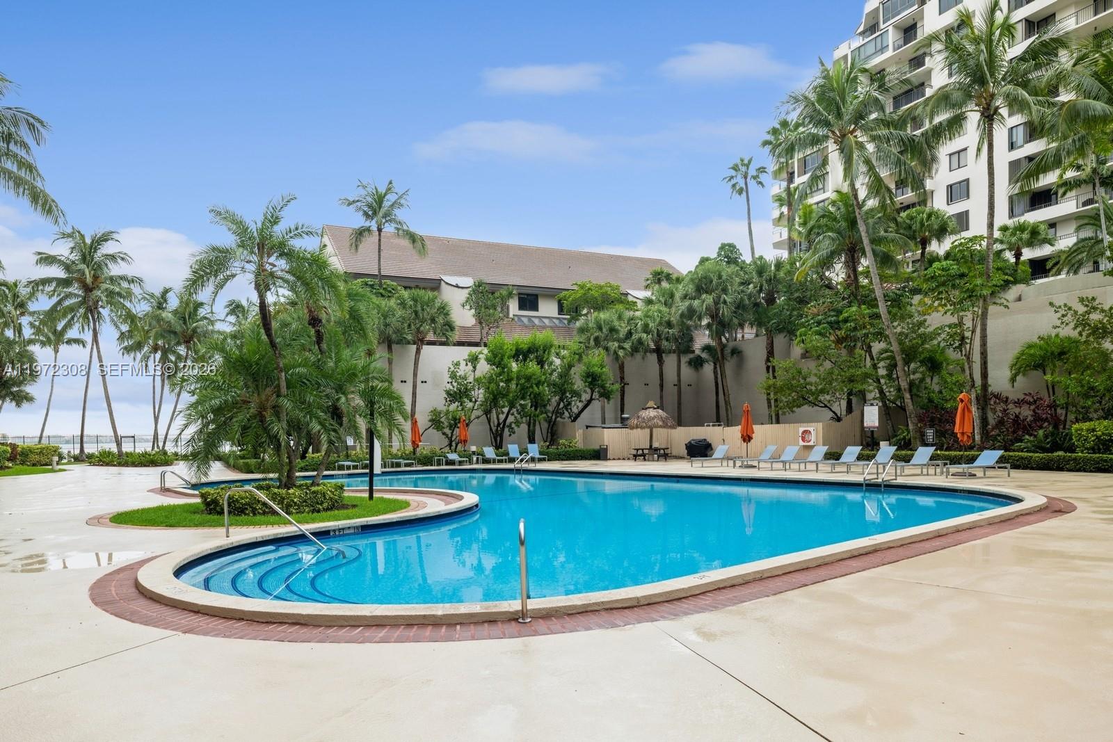 540 Brickell Key Drive, Unit 504 Miami, FL 33131 - Photo 5 of 31 a view of a swimming pool with a patio