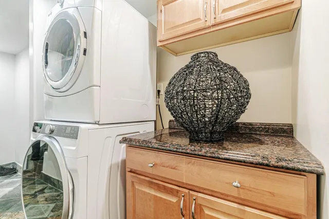 a close view of a sink and a washer dryer
