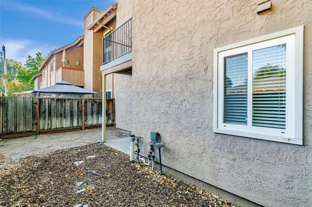 a garden view with wooden fence