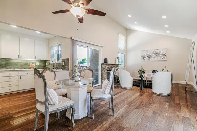 a view of a dining room with furniture and wooden floor