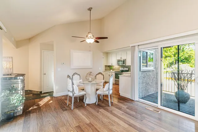 a view of a dining room with furniture window and wooden floor