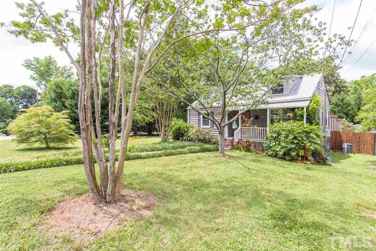 1801 Rankin Street Raleigh, NC 27604 - Photo 2 of 3 a backyard of a house with plants and large trees