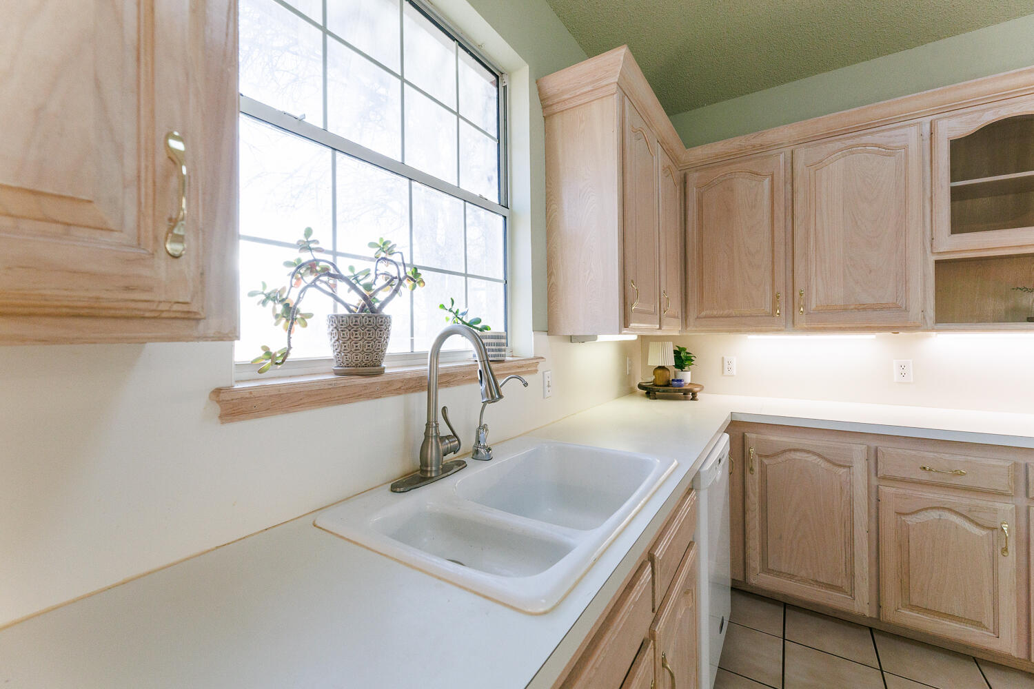206 Collins Avenue Sundown, TX 79372 - Photo 22 of 82 a kitchen with a sink cabinets and window