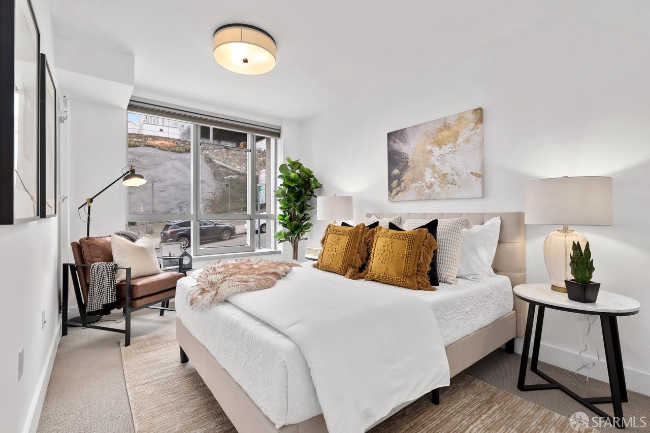 8 Buchanan Street, Unit 200L San Francisco, CA 94102 - Photo 11 of 27 a bedroom with a bed and a window