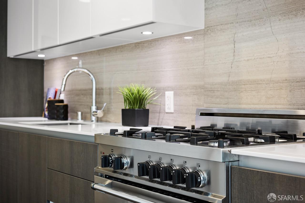 8 Buchanan Street, Unit 200L San Francisco, CA 94102 - Photo 5 of 27 a kitchen with a sink a stove and cabinets