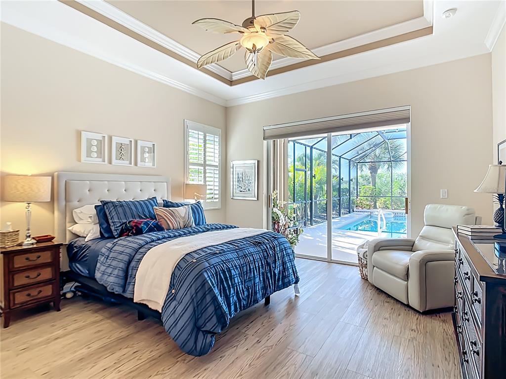 114 Rimini Way North Venice, FL 34275 - Photo 12 of 54 a bedroom with a bed and a couch