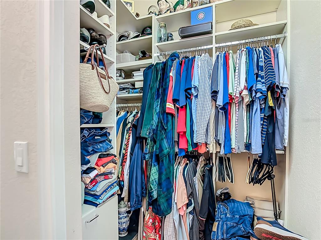114 Rimini Way North Venice, FL 34275 - Photo 20 of 54 a view of walk in closet with clothes