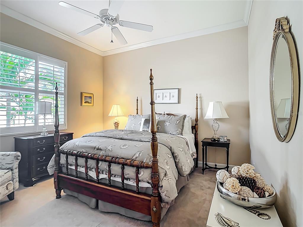 114 Rimini Way North Venice, FL 34275 - Photo 21 of 54 a bedroom with a bed chair and a window