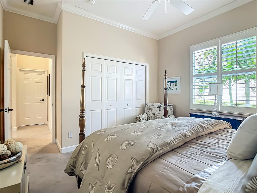 114 Rimini Way North Venice, FL 34275 - Photo 22 of 54 a bedroom with a bed and a window