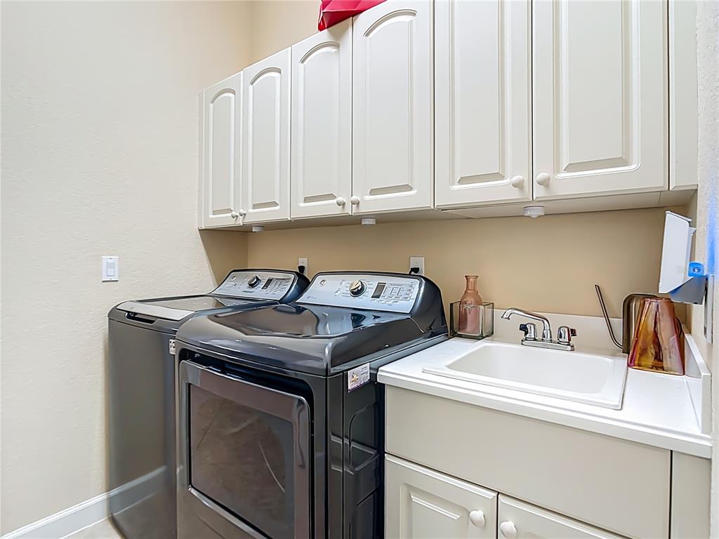 114 Rimini Way North Venice, FL 34275 - Photo 30 of 54 a utility room with dryer and washer