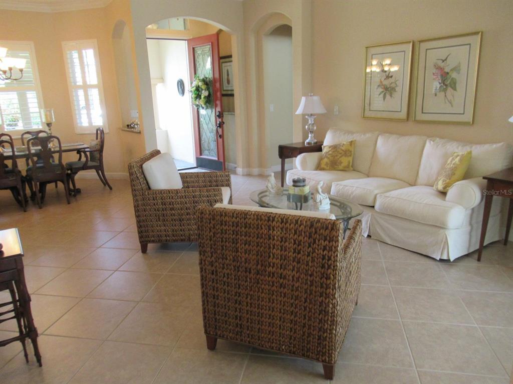 114 Rimini Way North Venice, FL 34275 - Photo 3 of 54 a living room with furniture and a large window