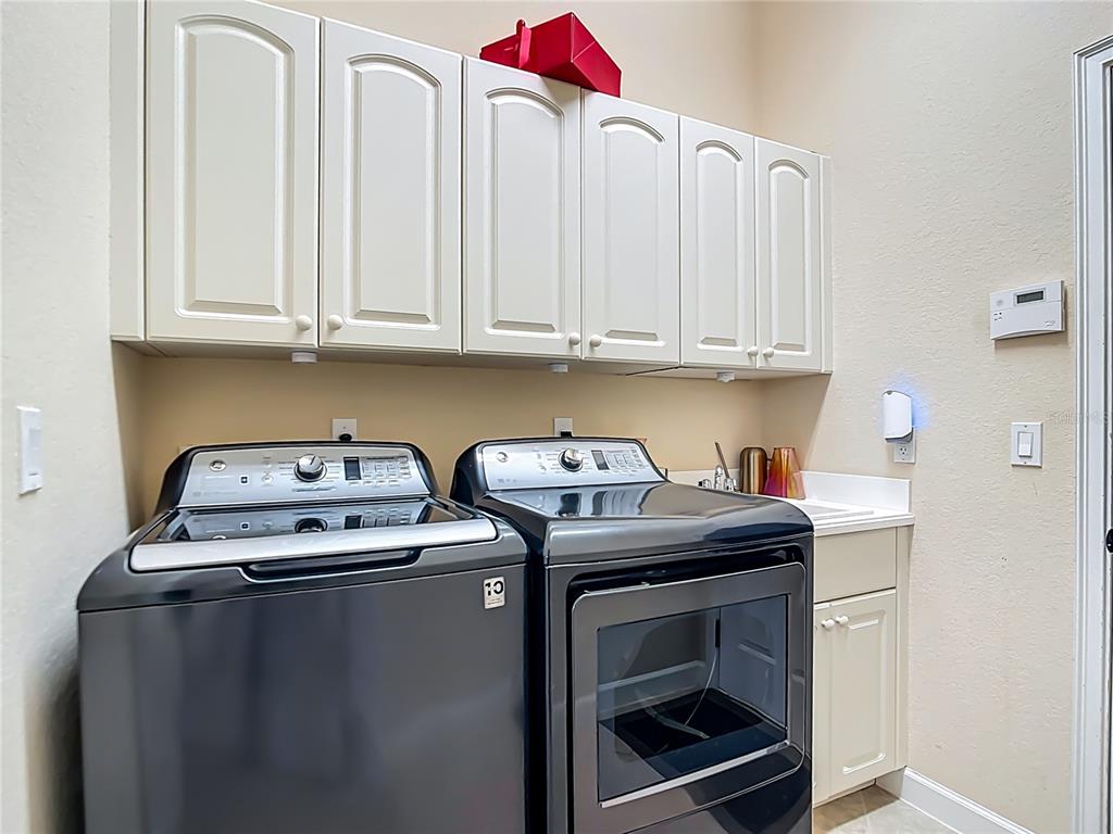 114 Rimini Way North Venice, FL 34275 - Photo 31 of 54 a kitchen with stainless steel appliances granite countertop a sink stove and cabinets