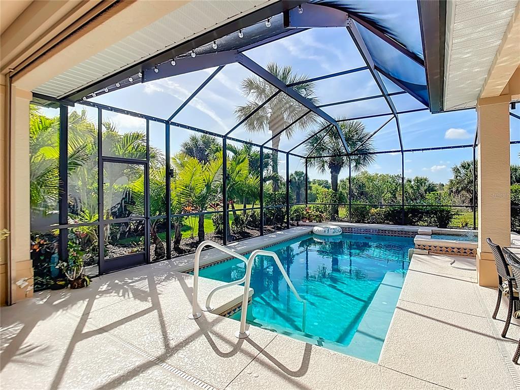 114 Rimini Way North Venice, FL 34275 - Photo 32 of 54 a view of a swimming pool with a patio